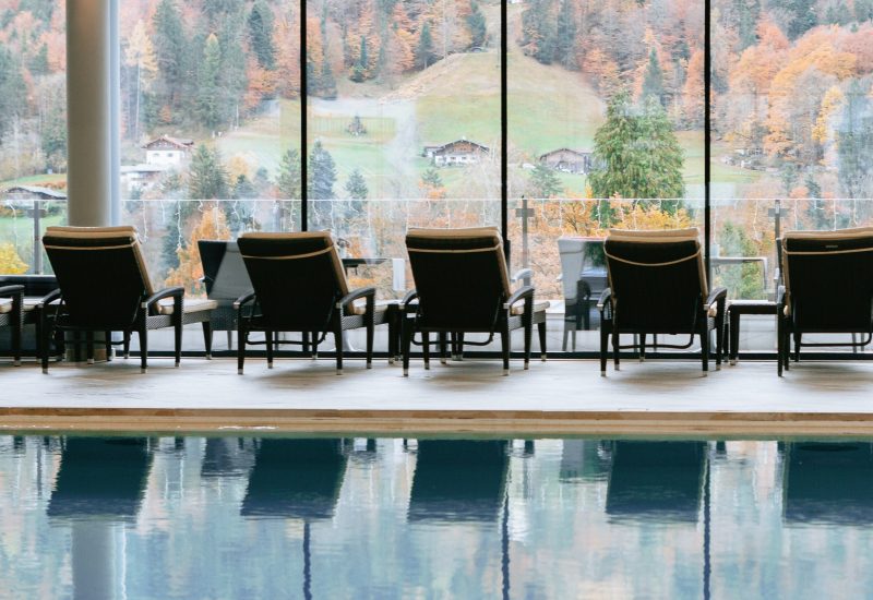Indoor swimming pool with panoramic Alpine views at a wellness hotel in Berchtesgaden