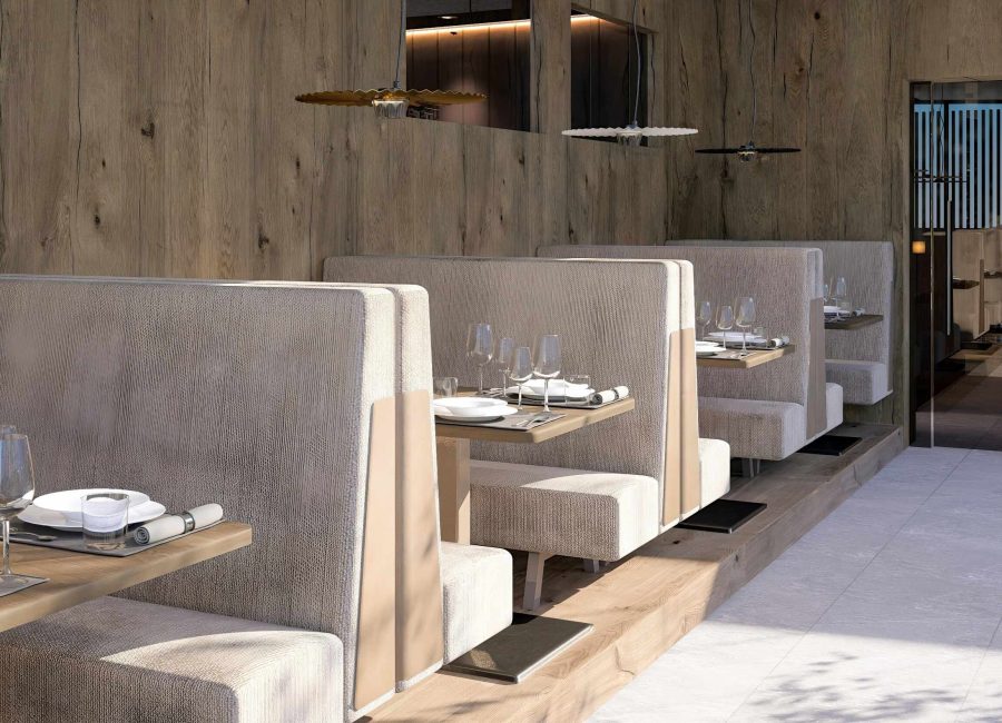 Elegant pool bistro at Hotel EDELWEISS Berchtesgaden with cozy seating booths, set tables and warm wooden design, creating a relaxed and stylish dining experience in the spa area