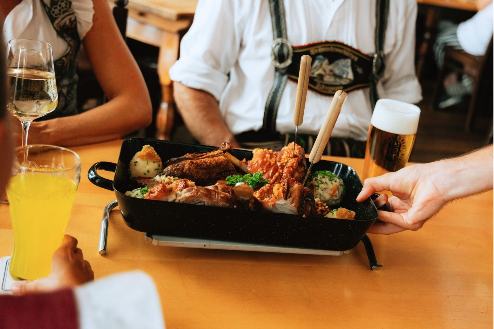 Traditional Bavarian roast pork and pork knuckle served at Gasthof NEUHAUS in Berchtesgaden